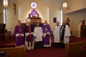 image of the clergy in front of the alter at St. Timothy's ACC